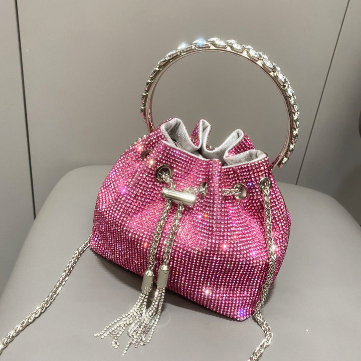 Yuma | Elegante zylindrische Metallic-Handtasche