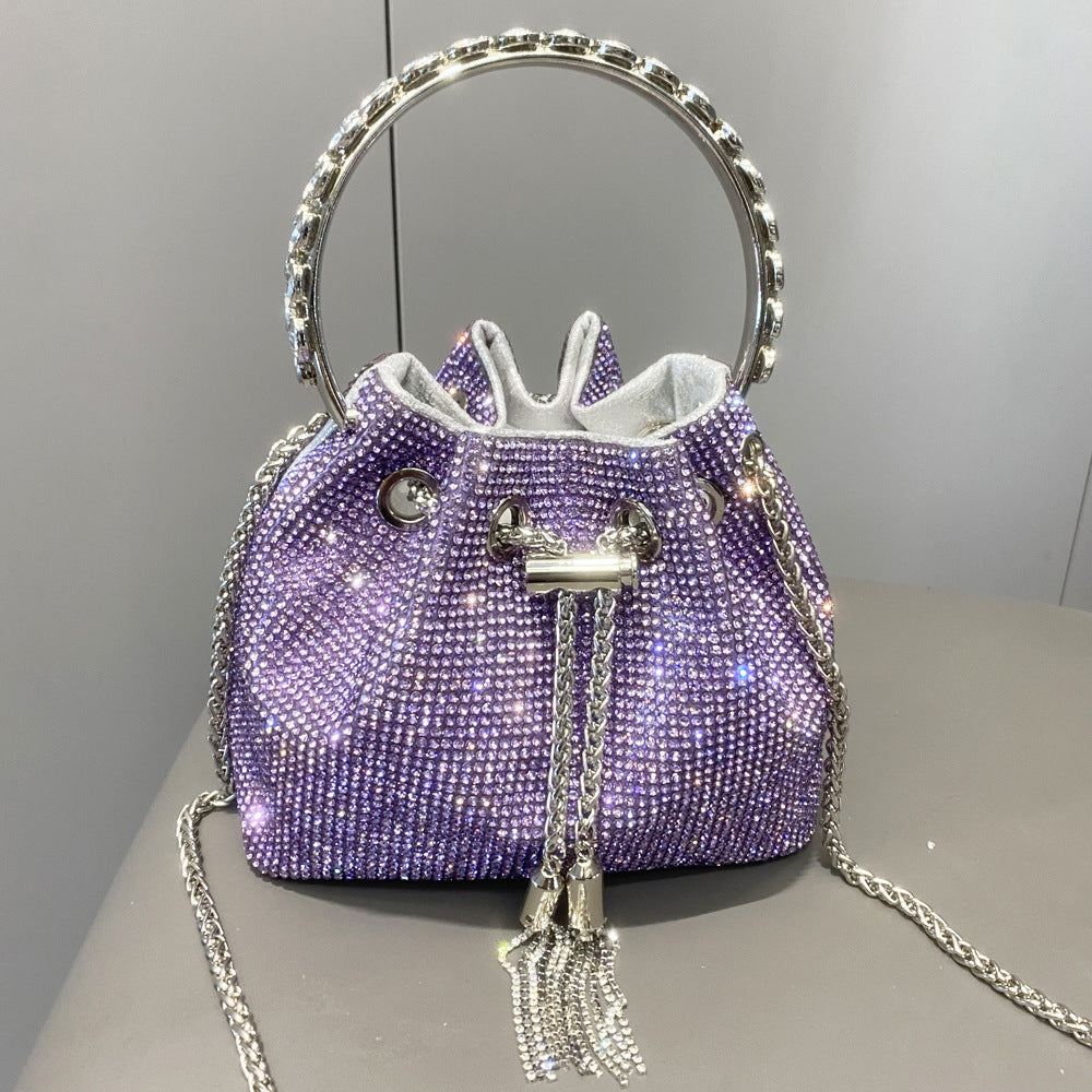 Yuma | Elegante zylindrische Metallic-Handtasche