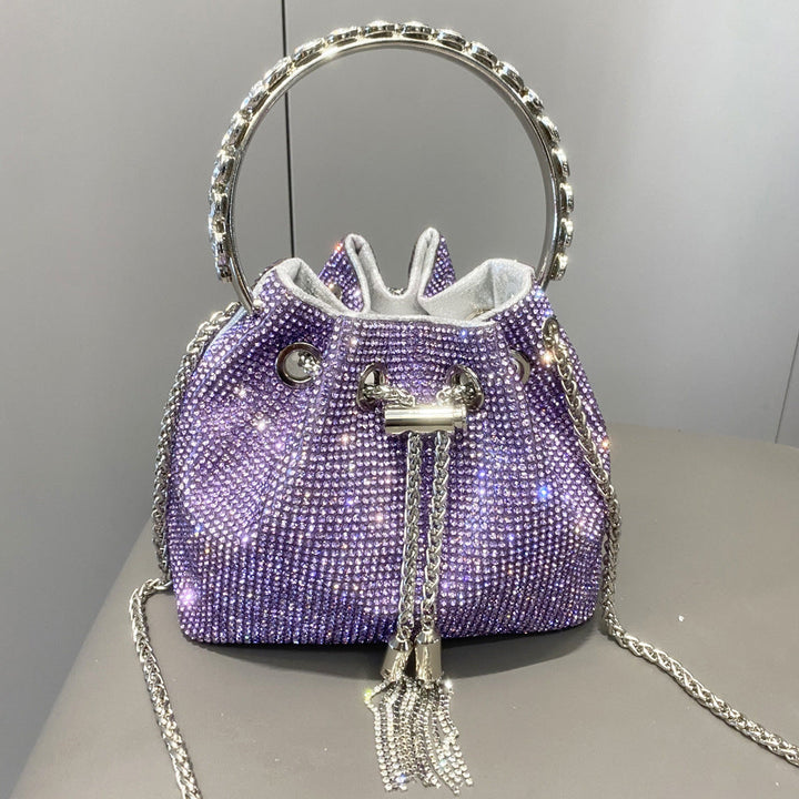 Yuma | Elegante zylindrische Metallic-Handtasche