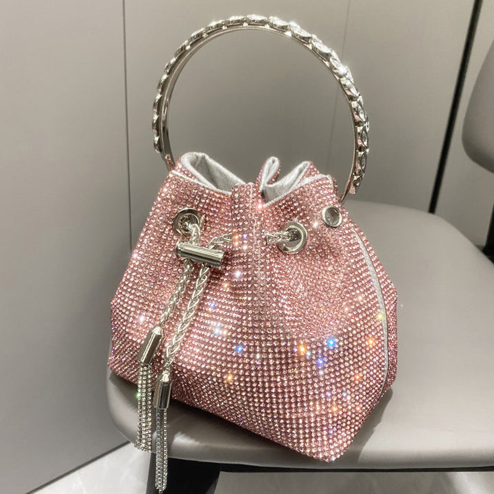 Yuma | Elegante zylindrische Metallic-Handtasche