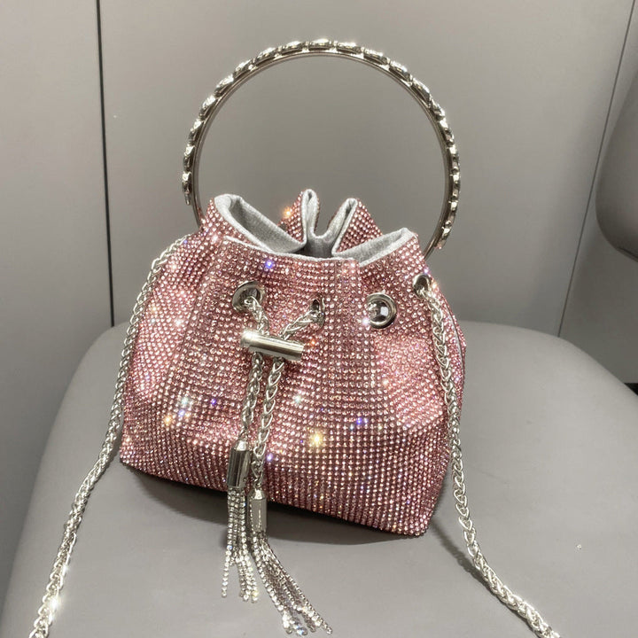 Yuma | Elegante zylindrische Metallic-Handtasche