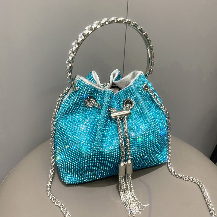 Yuma | Elegante zylindrische Metallic-Handtasche