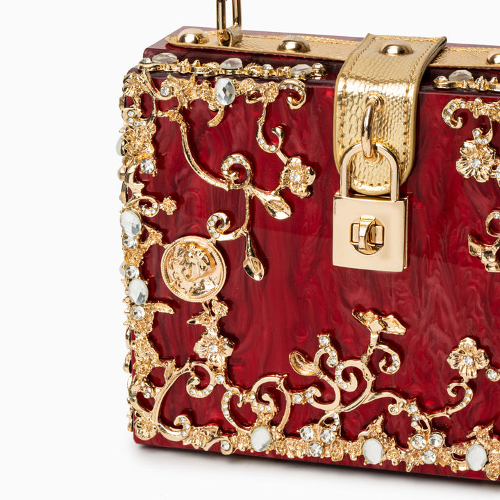 Zarqa  | Acryl Clutch mit Gold‑Blüten