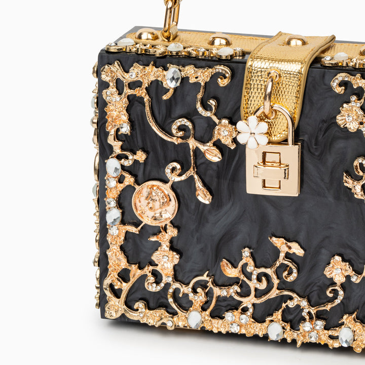Zarqa  | Acryl Clutch mit Gold‑Blüten