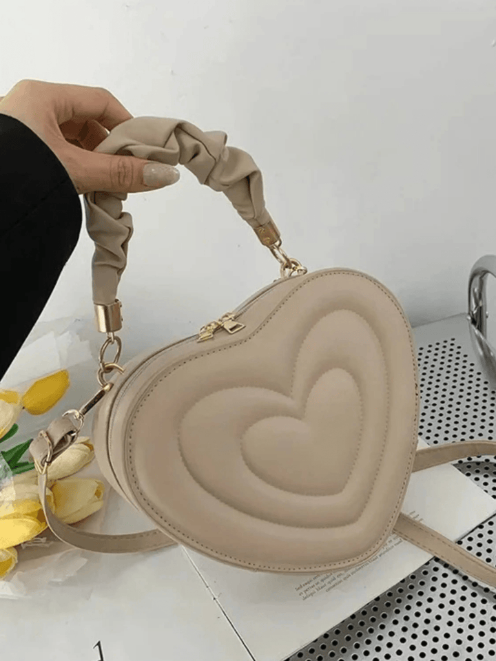 Warri | verspielte Herz‑Form‑Ledertasche
