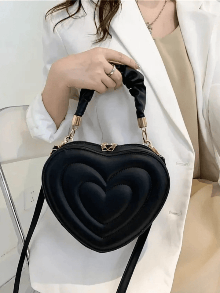 Warri | verspielte Herz‑Form‑Ledertasche